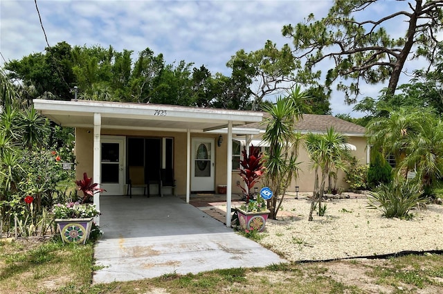 7425 W Maryland Ave W, Hudson, FL 34667 - view of front of home with stucco siding