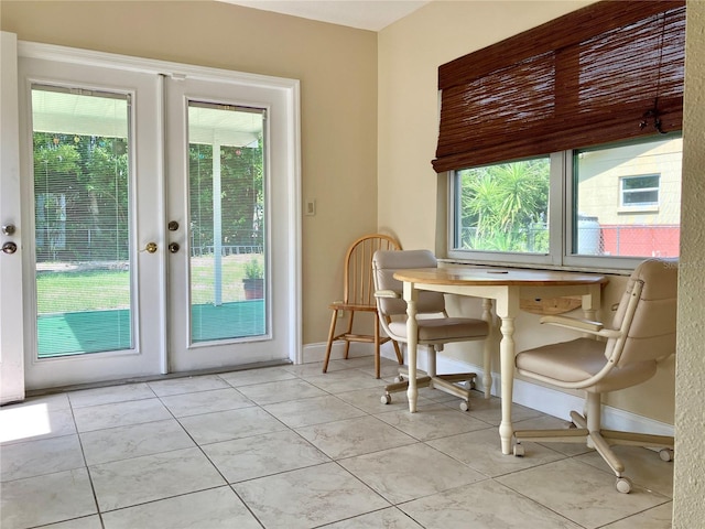 7425 W Maryland Ave W, Hudson, FL 34667 - dining area featuring french doors, light tile patterned floors, and baseboards
