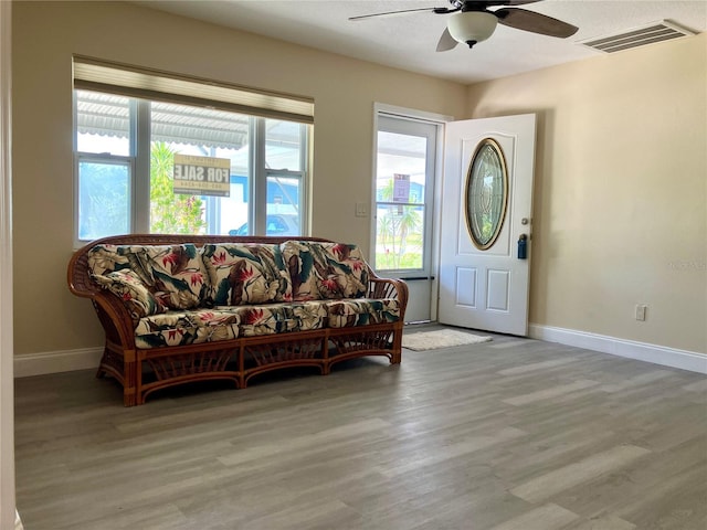 7425 W Maryland Ave W, Hudson, FL 34667 - entryway with ceiling fan, baseboards, and wood finished floors