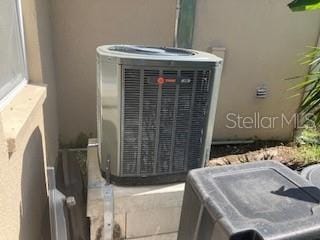 7425 W Maryland Ave W, Hudson, FL 34667 - exterior view of stucco siding and cooling unit