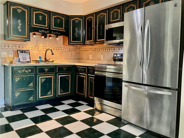 7425 W Maryland Ave W, Hudson, FL 34667 - kitchen featuring stainless steel appliances, tile patterned floors, light countertops, and backsplash