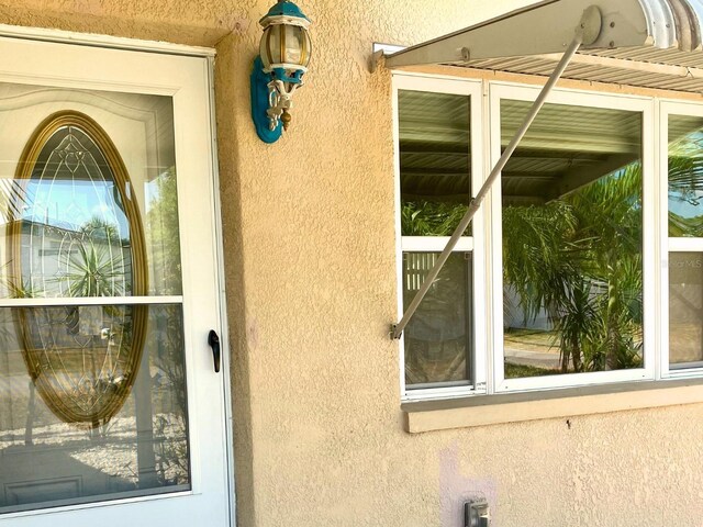7425 W Maryland Ave W, Hudson, FL 34667 - exterior view of stucco siding