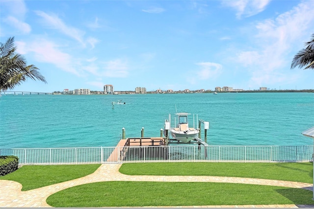 297 1st St W, Tierra Verde, FL 33715 - dock featuring boat lift, a water view, and a view of skyline