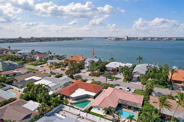 297 1st St W, Tierra Verde, FL 33715 - aerial perspective of suburban area featuring a pool area and a large body of water