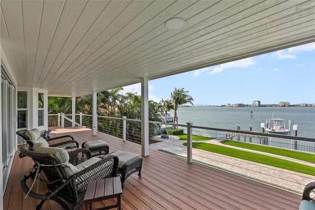 297 1st St W, Tierra Verde, FL 33715 - wooden terrace featuring boat lift, a water view, and a dock