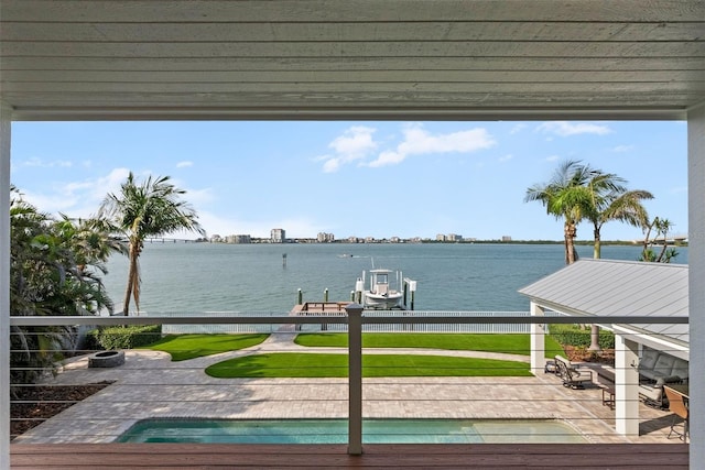 297 1st St W, Tierra Verde, FL 33715 - wooden terrace with boat lift, a water view, a boat dock, and a patio