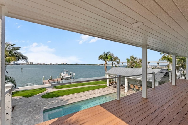 297 1st St W, Tierra Verde, FL 33715 - dock with boat lift, a water view, an outdoor pool, and a patio area
