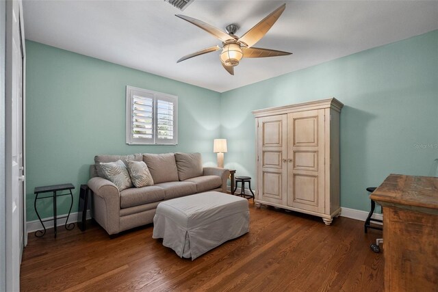 297 1st St W, Tierra Verde, FL 33715 - living room with a ceiling fan and dark wood finished floors