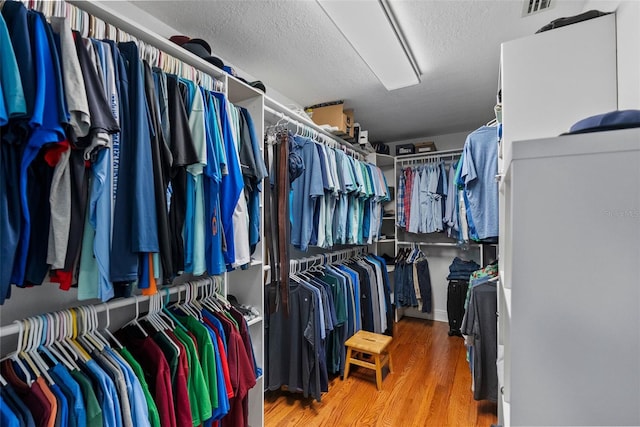 297 1st St W, Tierra Verde, FL 33715 - walk in closet featuring wood finished floors