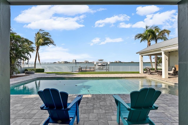 297 1st St W, Tierra Verde, FL 33715 - view of swimming pool featuring a patio and a water view
