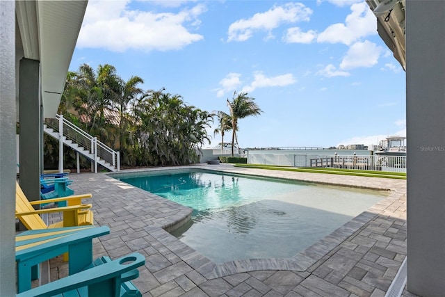 297 1st St W, Tierra Verde, FL 33715 - swimming pool featuring a patio and stairs