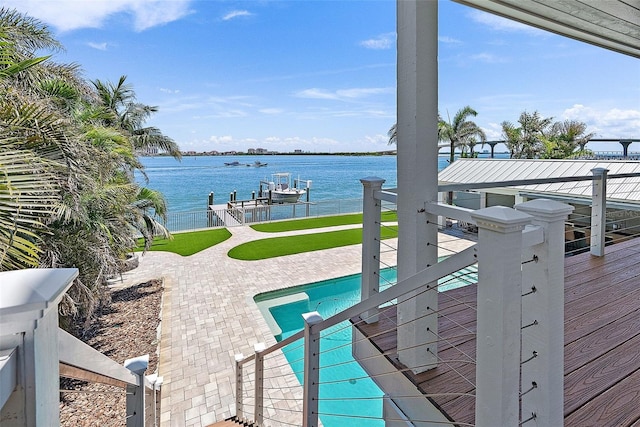 297 1st St W, Tierra Verde, FL 33715 - outdoor pool with a dock, a water view, boat lift, and a patio