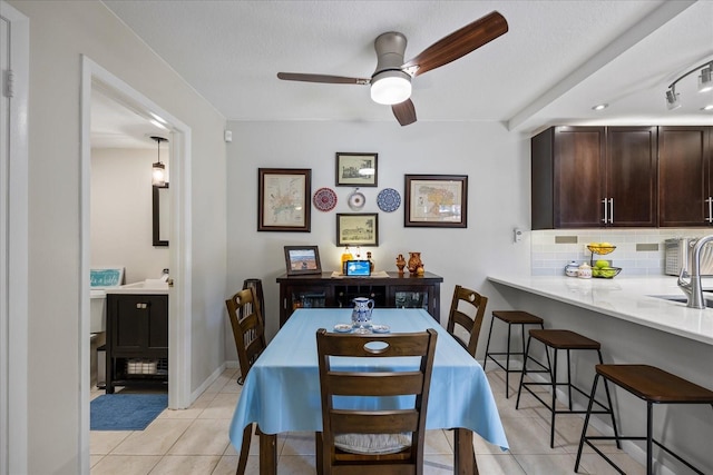 2626 2nd Ct, Palm Harbor, FL 34684 - dining area with a ceiling fan and light tile patterned flooring