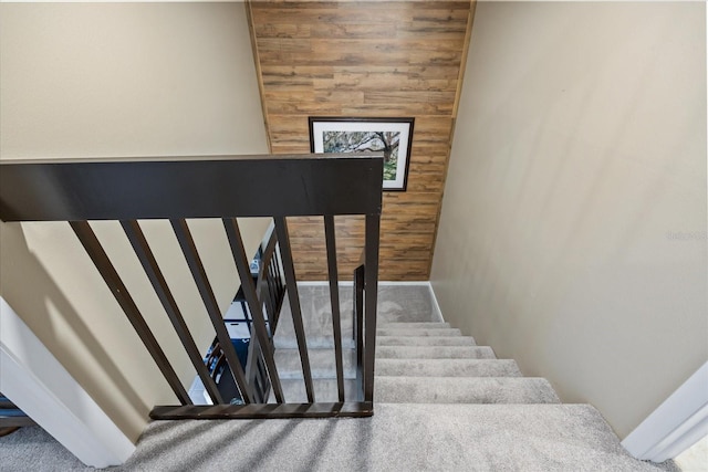 2626 2nd Ct, Palm Harbor, FL 34684 - staircase featuring baseboards, carpet, and wood walls