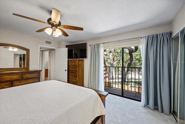 2626 2nd Ct, Palm Harbor, FL 34684 - carpeted bedroom featuring access to outside, a ceiling fan, and a textured ceiling
