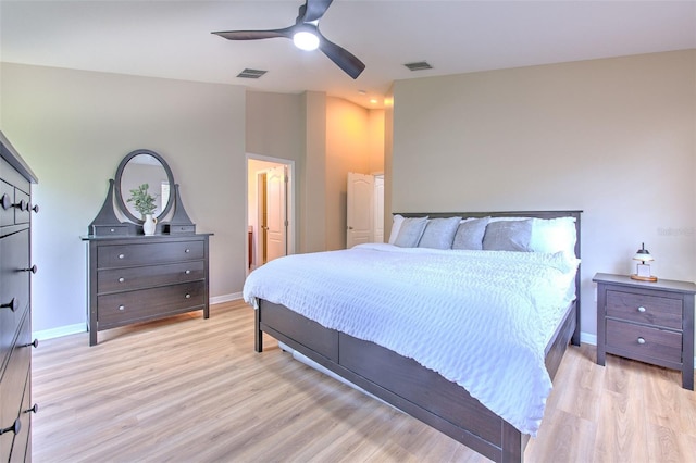 bedroom with light wood-type flooring, baseboards, and a ceiling fan