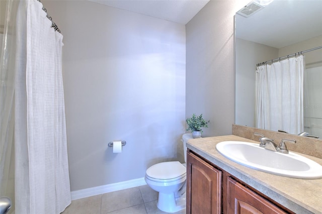 full bath with toilet, tile patterned floors, vanity, and baseboards