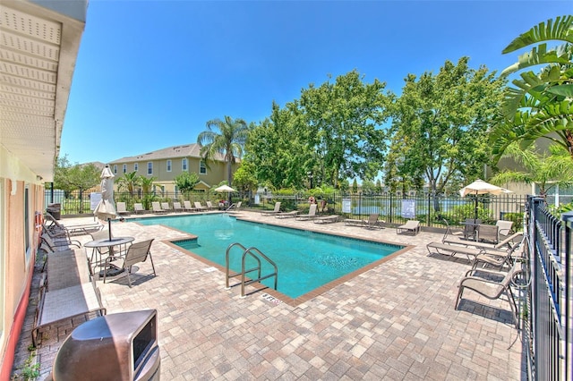 community pool with a patio area
