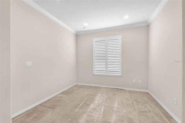 unfurnished room with carpet, ornamental molding, recessed lighting, and baseboards