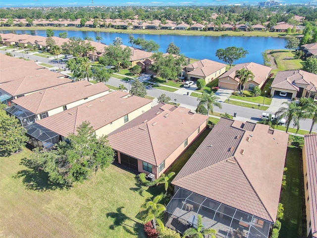 aerial view of residential area featuring a nearby body of water