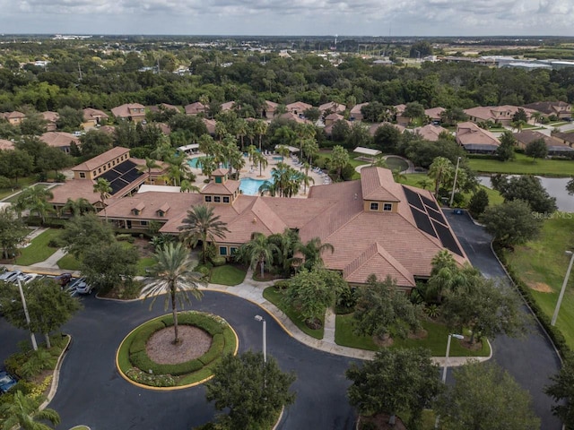 bird's eye view of a pool area and a large body of water