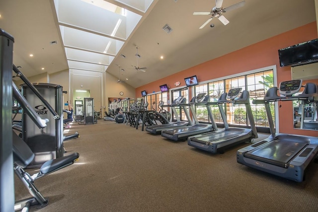 gym with a ceiling fan, high vaulted ceiling, and carpet flooring