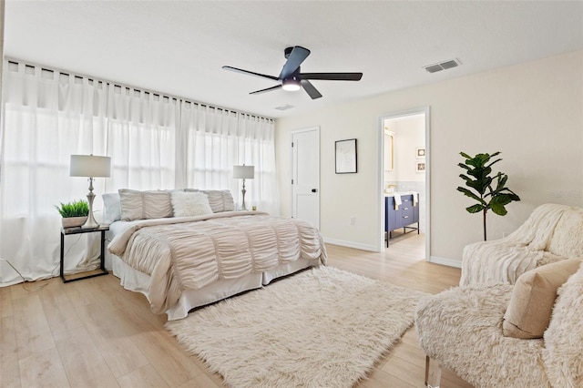 5724 Dr Martin Luther King Jr St N Unit J, Saint Petersburg, FL 33703 - bedroom featuring light wood-style floors, baseboards, and a ceiling fan