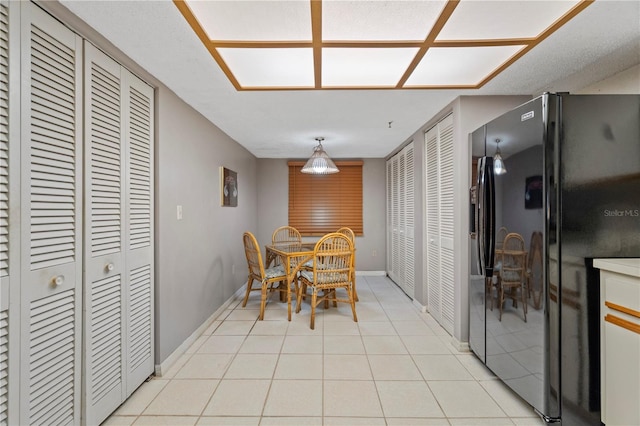 18400 Gulf Blvd Unit 1105, Indian Shores, FL 33785 - dining space featuring baseboards and light tile patterned floors
