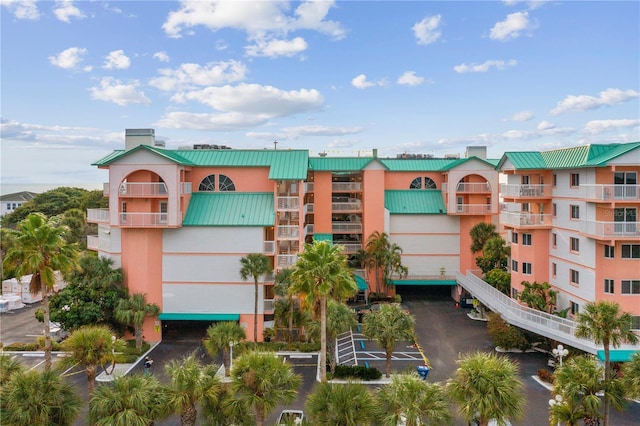 18400 Gulf Blvd Unit 1105, Indian Shores, FL 33785 - view of building exterior with uncovered parking
