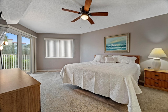 18400 Gulf Blvd Unit 1105, Indian Shores, FL 33785 - bedroom with light colored carpet, access to exterior, a textured ceiling, baseboards, and a ceiling fan