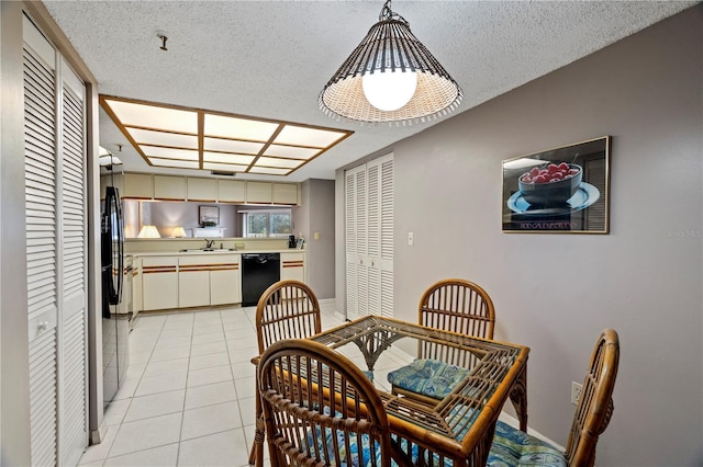 18400 Gulf Blvd Unit 1105, Indian Shores, FL 33785 - dining area featuring light tile patterned floors and a textured ceiling
