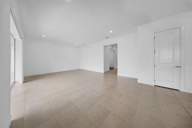 spare room with recessed lighting
