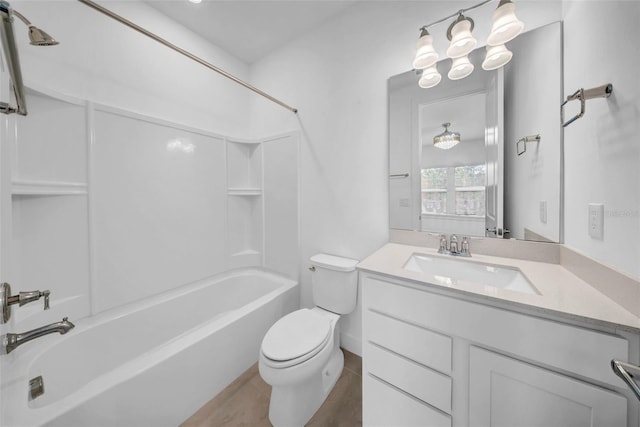 bathroom with toilet, washtub / shower combination, and vanity