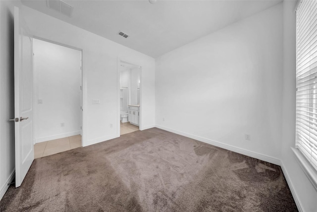 13855 Sharp Hawk Dr, Riverview, FL 33569 - unfurnished bedroom with carpet, multiple windows, baseboards, and ensuite bath
