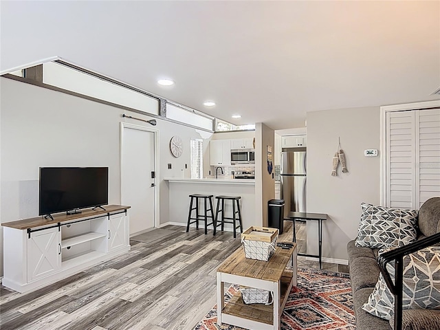 2653 N Seabreeze Pt Unit M-2, Crystal River, FL 34429 - living room with light wood-style floors, baseboards, and recessed lighting