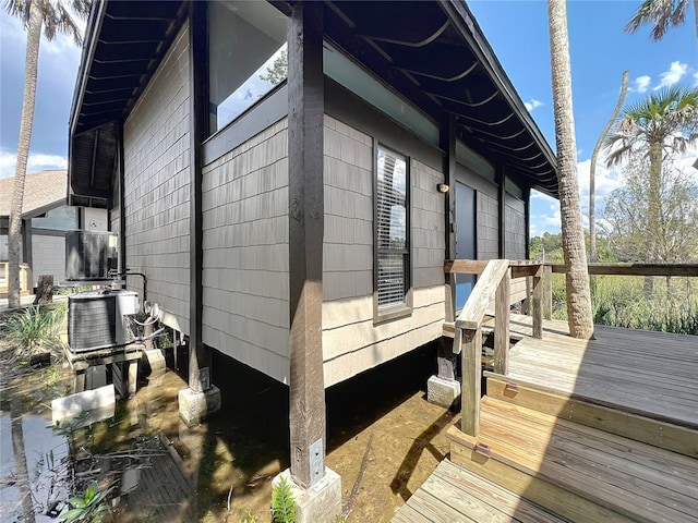 2653 N Seabreeze Pt Unit M-2, Crystal River, FL 34429 - view of home's exterior featuring a wooden deck and central AC