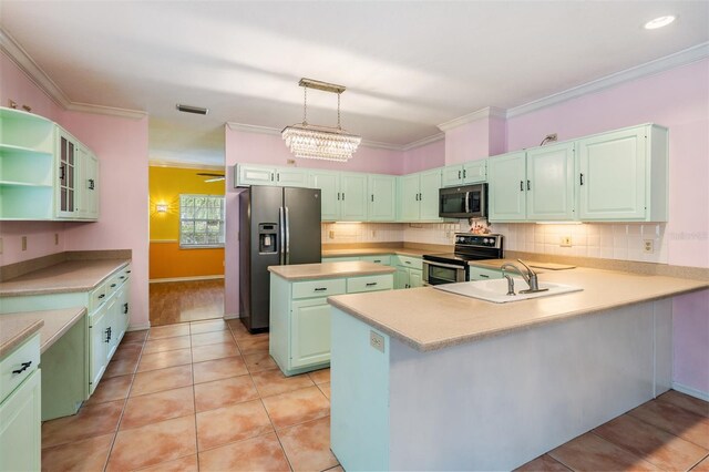 3013 Crest Dr, Clearwater, FL 33759 - kitchen with appliances with stainless steel finishes, a sink, decorative backsplash, light countertops, and a peninsula