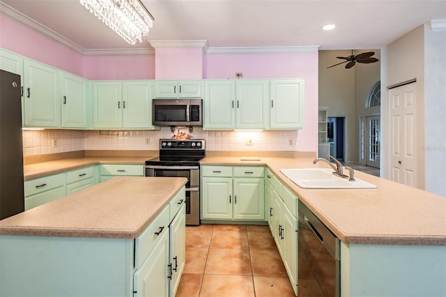 3013 Crest Dr, Clearwater, FL 33759 - kitchen featuring appliances with stainless steel finishes, a sink, backsplash, light countertops, and ornamental molding