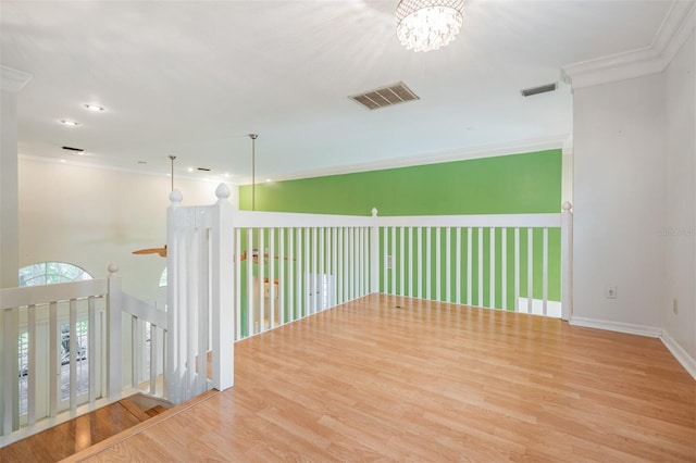 3013 Crest Dr, Clearwater, FL 33759 - unfurnished room with wood finished floors, crown molding, a chandelier, baseboards, and recessed lighting