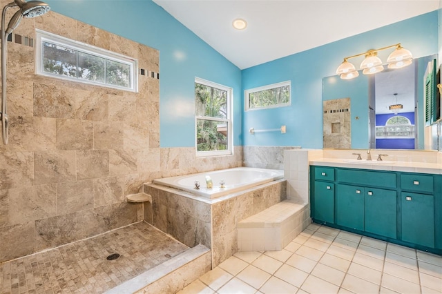 3013 Crest Dr, Clearwater, FL 33759 - full bath with vaulted ceiling, vanity, a garden tub, tile patterned flooring, and tiled shower