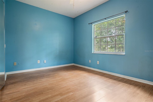 3013 Crest Dr, Clearwater, FL 33759 - unfurnished room featuring wood finished floors and baseboards
