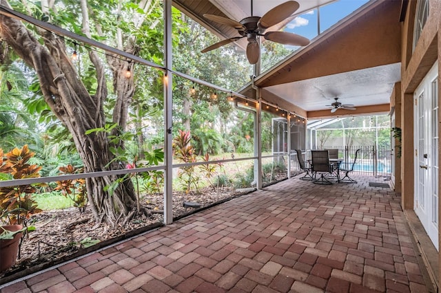 3013 Crest Dr, Clearwater, FL 33759 - unfurnished sunroom with a ceiling fan and outdoor dining space