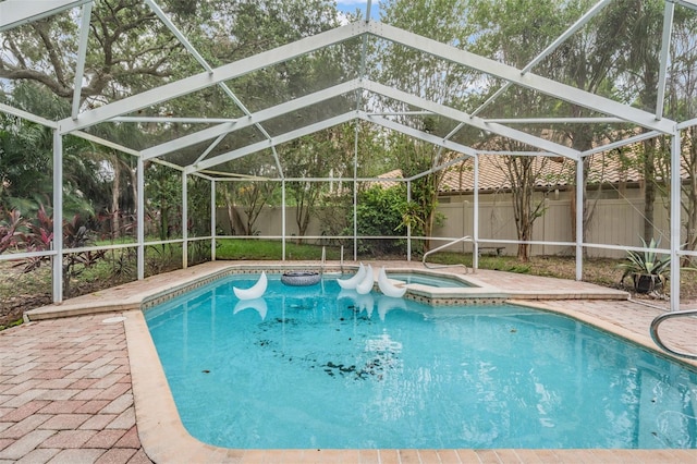 3013 Crest Dr, Clearwater, FL 33759 - view of pool featuring a fenced backyard, an in-ground hot tub, glass enclosure, and a patio