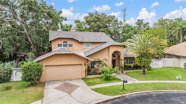 3013 Crest Dr, Clearwater, FL 33759 - traditional-style house featuring stucco siding, concrete driveway, an attached garage, a chimney, and roof with shingles
