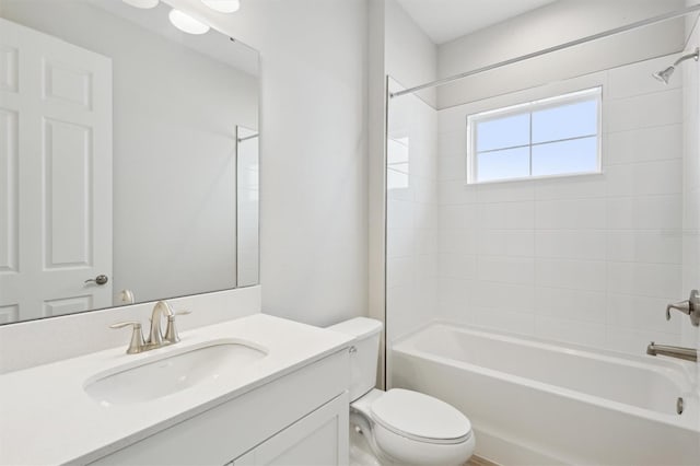 bathroom featuring shower / washtub combination, toilet, and vanity