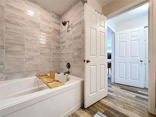 18001 Richmond Place Dr Unit 330, Tampa, FL 33647 - bathroom featuring wood finished floors and  shower combination