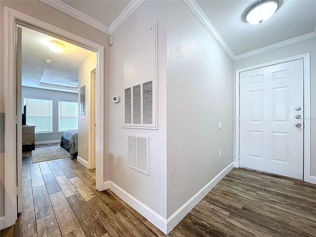 18001 Richmond Place Dr Unit 330, Tampa, FL 33647 - corridor featuring dark wood-style floors, crown molding, baseboards, and a textured wall