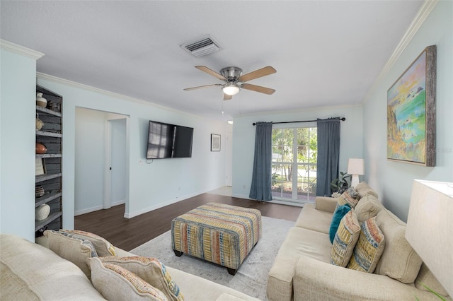 12913 126th Ter, Largo, FL 33774 - living area featuring a ceiling fan, wood finished floors, ornamental molding, and baseboards