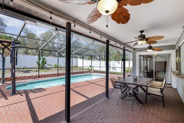 12913 126th Ter, Largo, FL 33774 - view of pool featuring a ceiling fan, a fenced backyard, a patio area, and a lanai