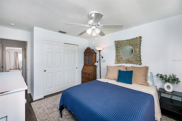 12913 126th Ter, Largo, FL 33774 - bedroom featuring a closet, wood finished floors, ceiling fan, and baseboards